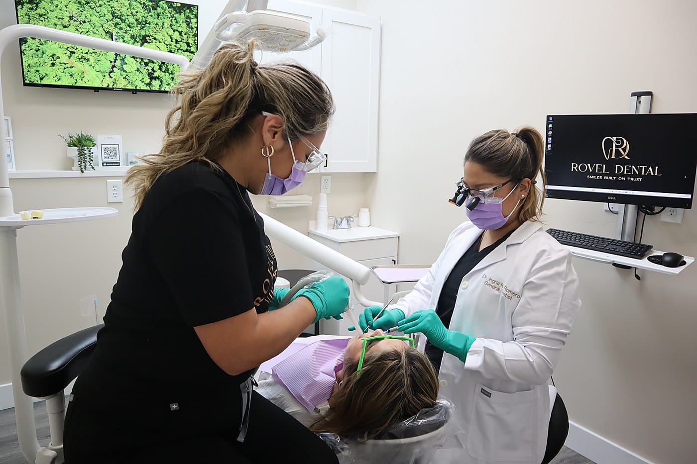 Dr. Ingrid R. Romero treating a patient at Rovel Dental in Palm Springs, FL